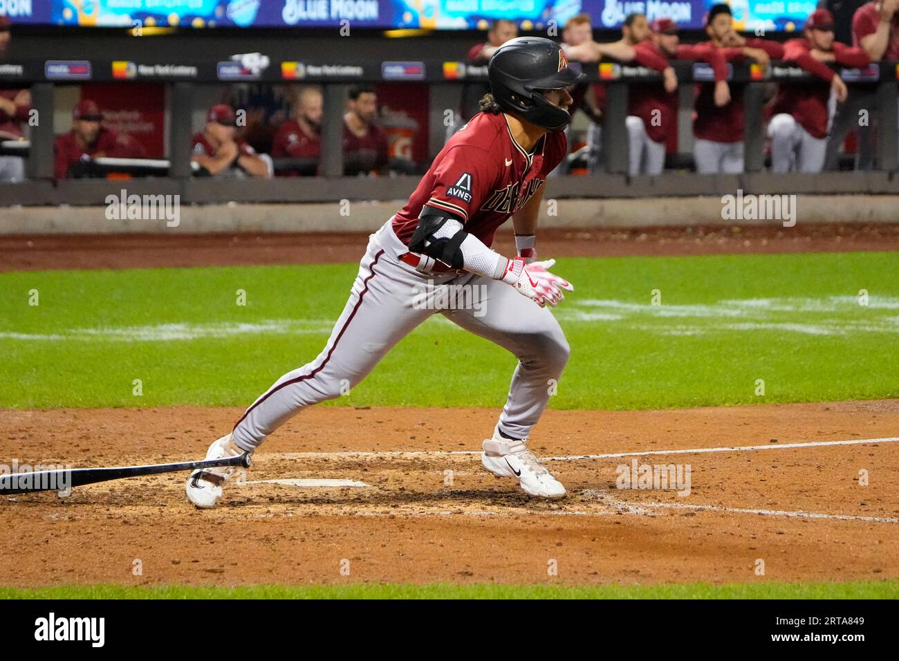 FLUSHING, NY - SEPTEMBER 11: Arizona Diamondbacks Left Fielder Lourdes  Gurriel Jr. (12) scores a run on Arizona Diamondbacks Third Baseman  Emmanuel Rivera (not pictured) sacrifice fly ball during the fourth inning