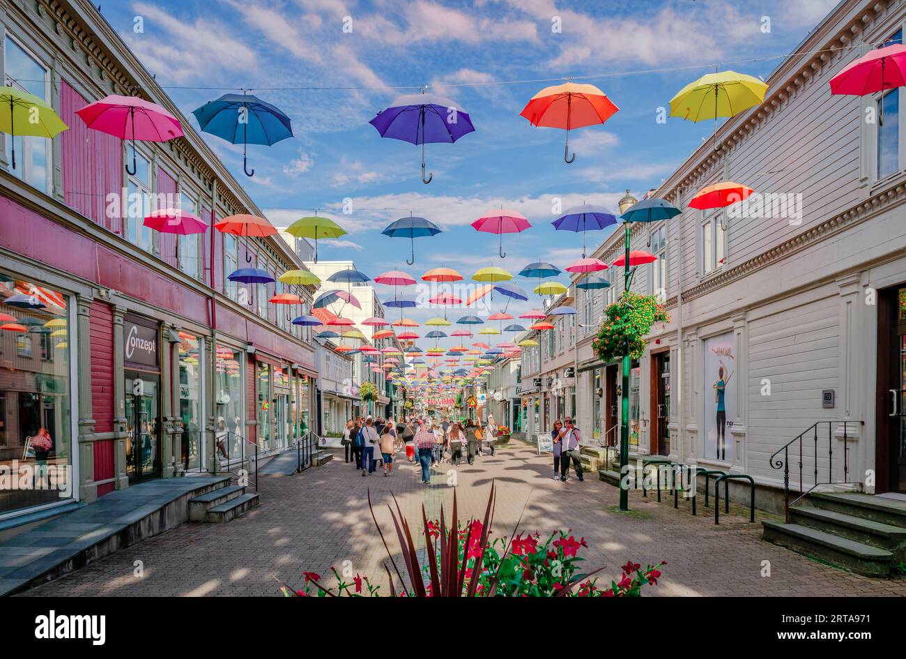 Trondheim, Norway - August 19 2022: An installation of colourful umbrellas above a street in the downtown of the city. Stock Photo