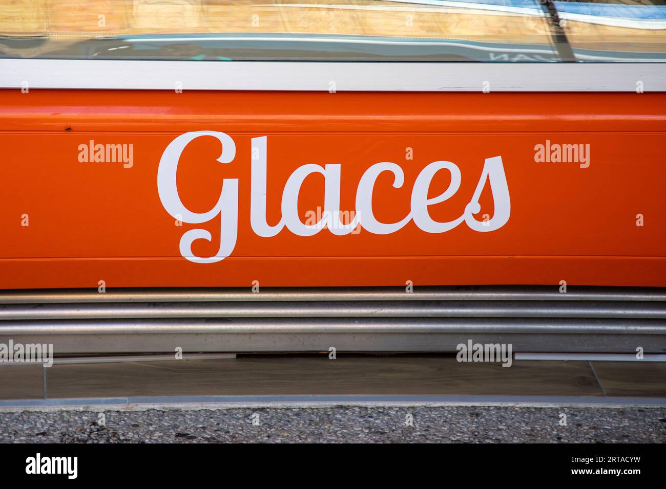 glaces text in French means ice cream on the fridge of an icecream