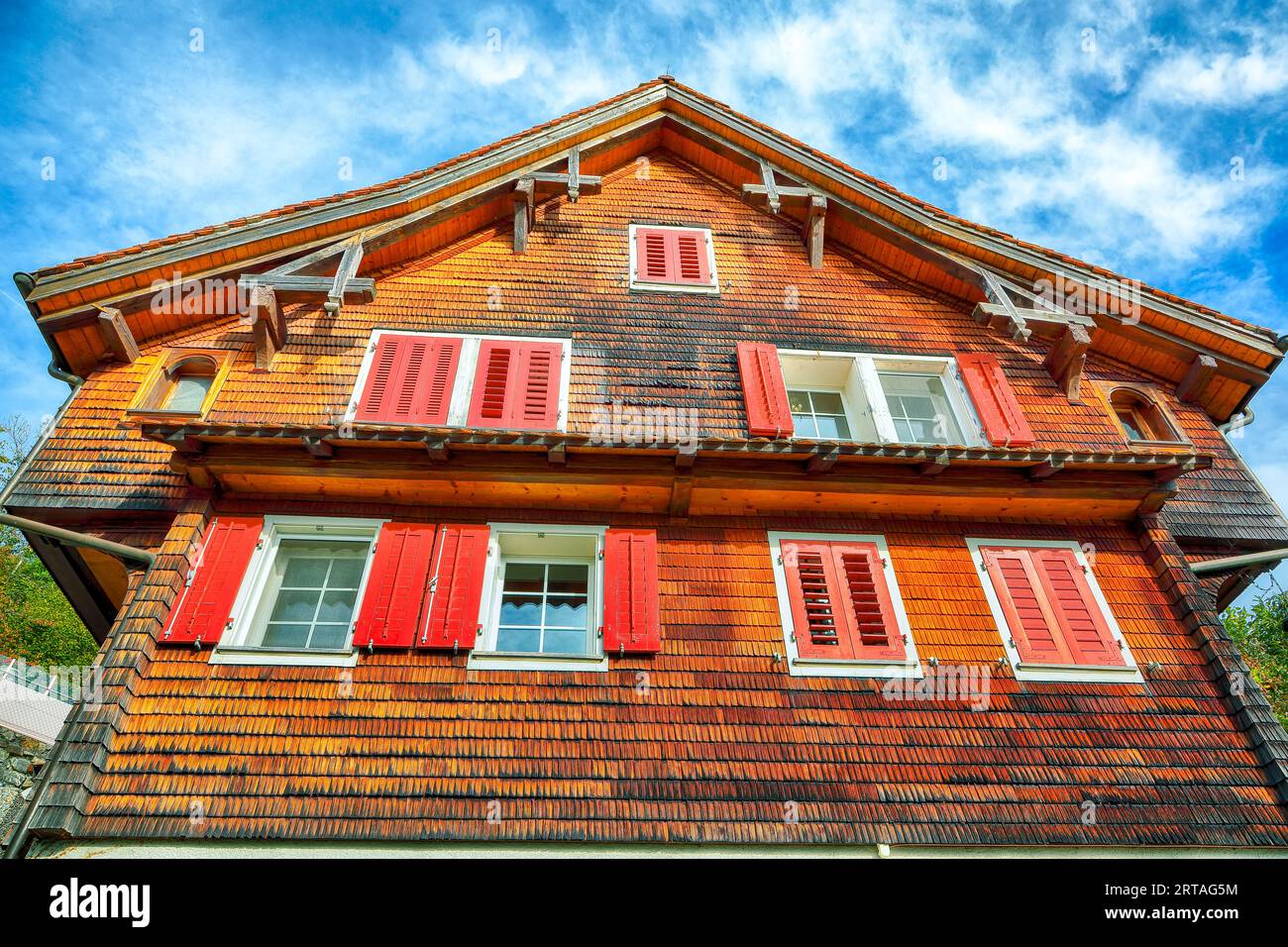Beautiful traditional wooden house in the alpine village. Popular travel destination in Swiss Alps.   Location: Stansstad, Canton of Nidwalden, Switze Stock Photo