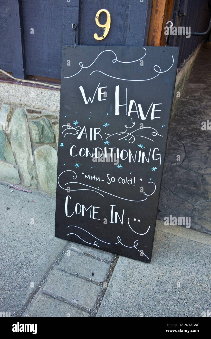 Restaurant sign advertising air conditioning during a heat wave in ...