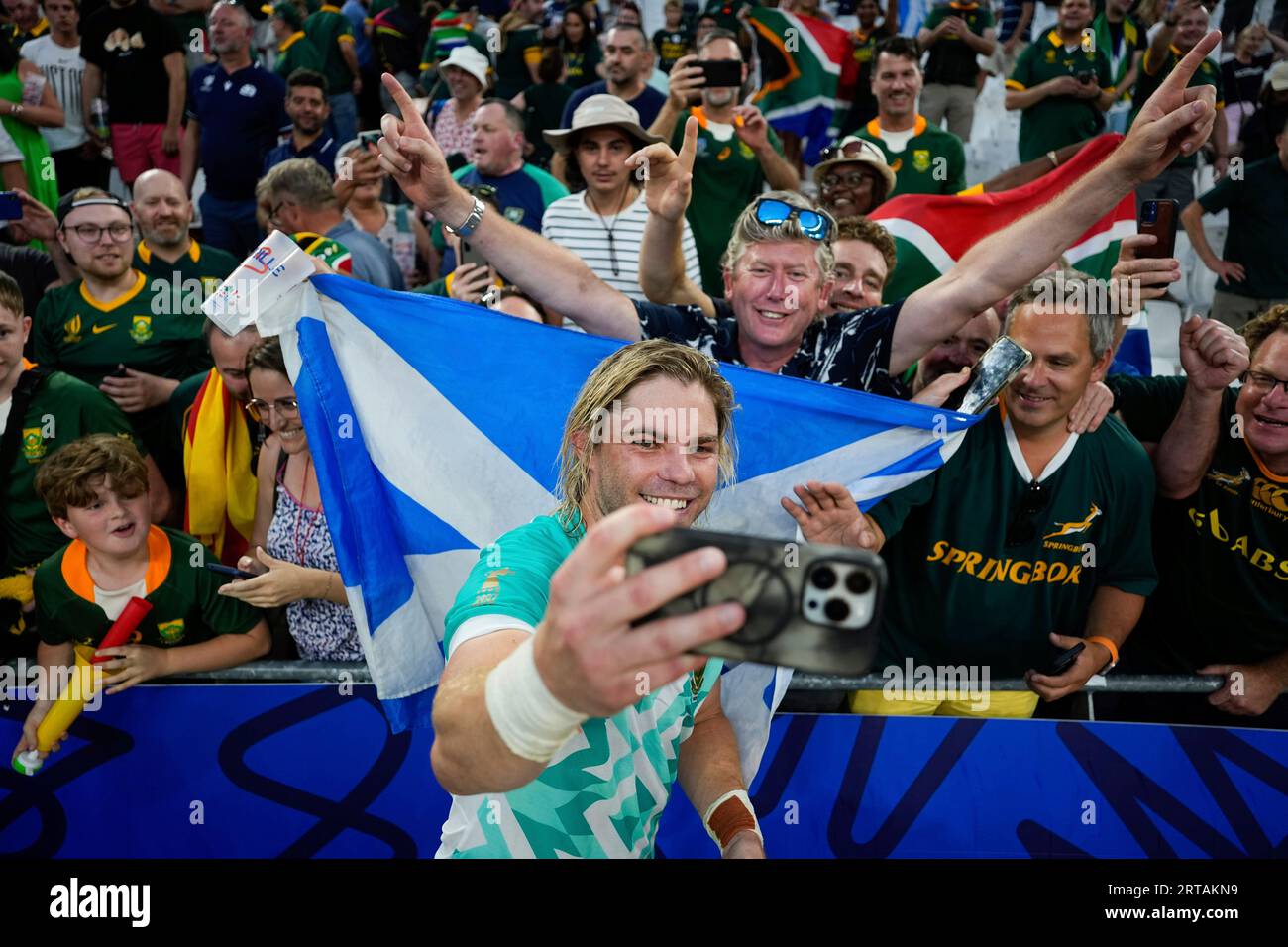 South Africa's Faf de Klerk takes a selfie with supporters as he celebrates  after the Rugby World Cup Pool B match between South Africa and Scotland at  the Stade de Marseille in