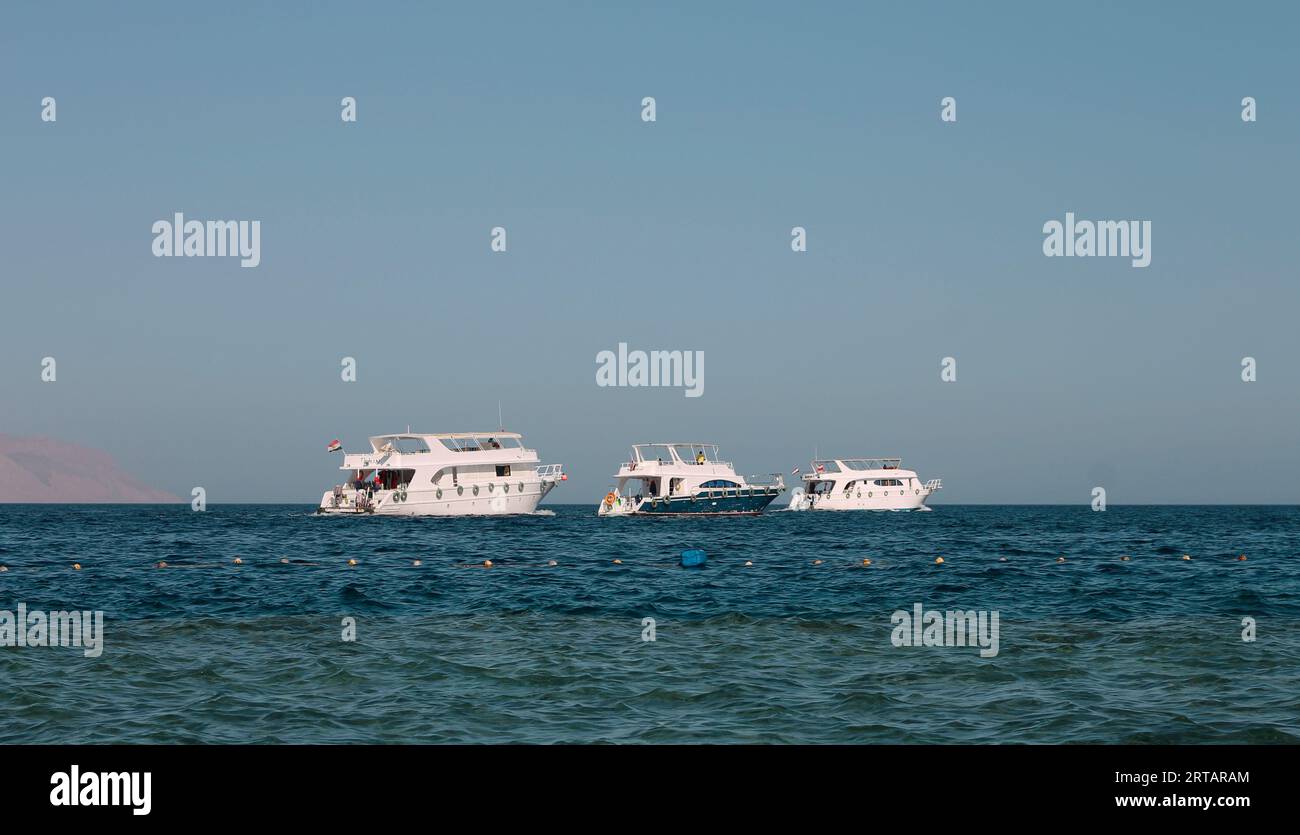 White Ship Moving By The Red Sea Stock Photo - Alamy