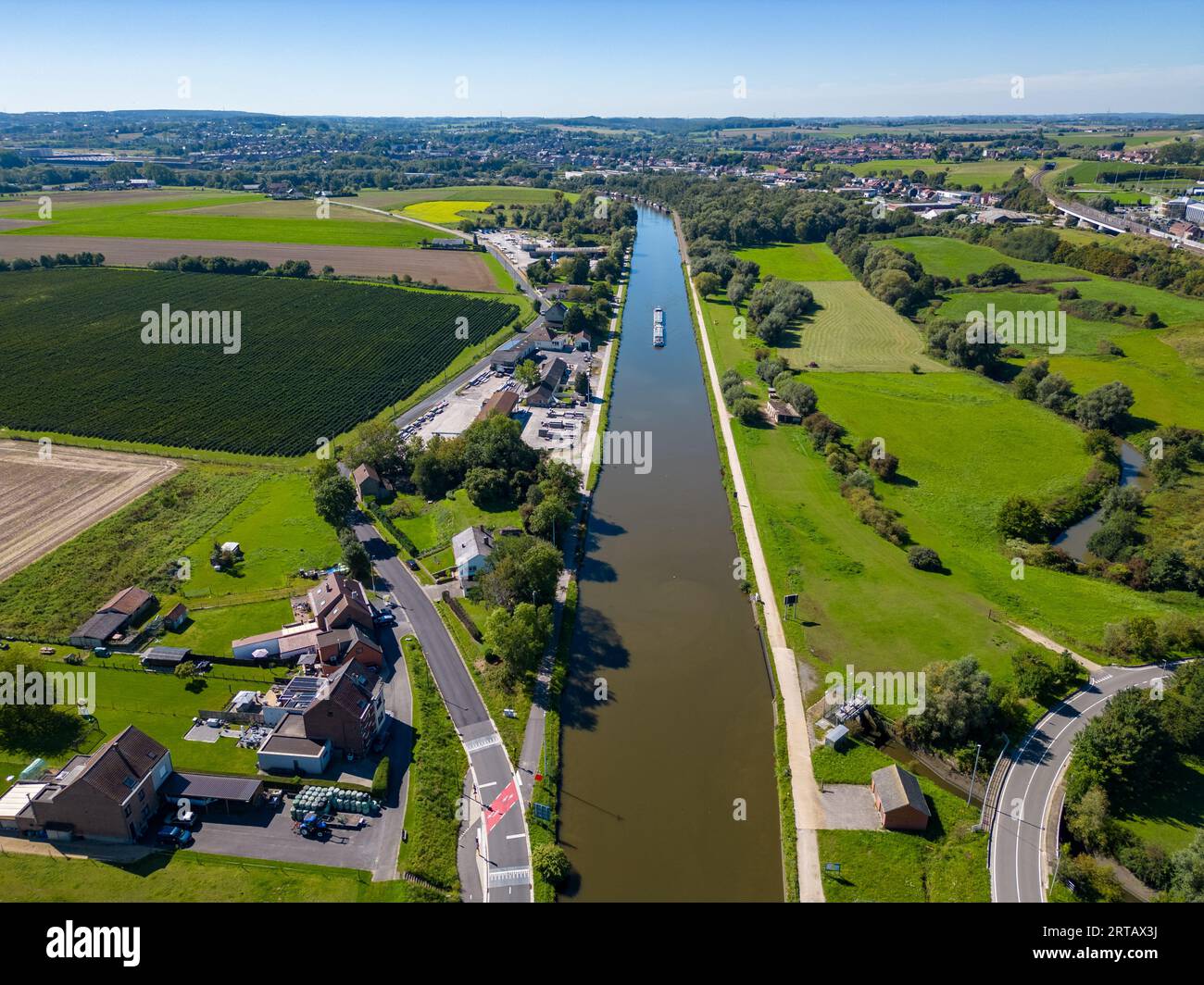 Lembeek, Halle, Vlaams Brabant, Belgium,Sep 5th 2023, cargo ship or barge passing on the Canal Brussels Charleroi, which is a man made waterway in Belgium. It's still in active use in transporting goods and raw material. High quality photo Stock Photo