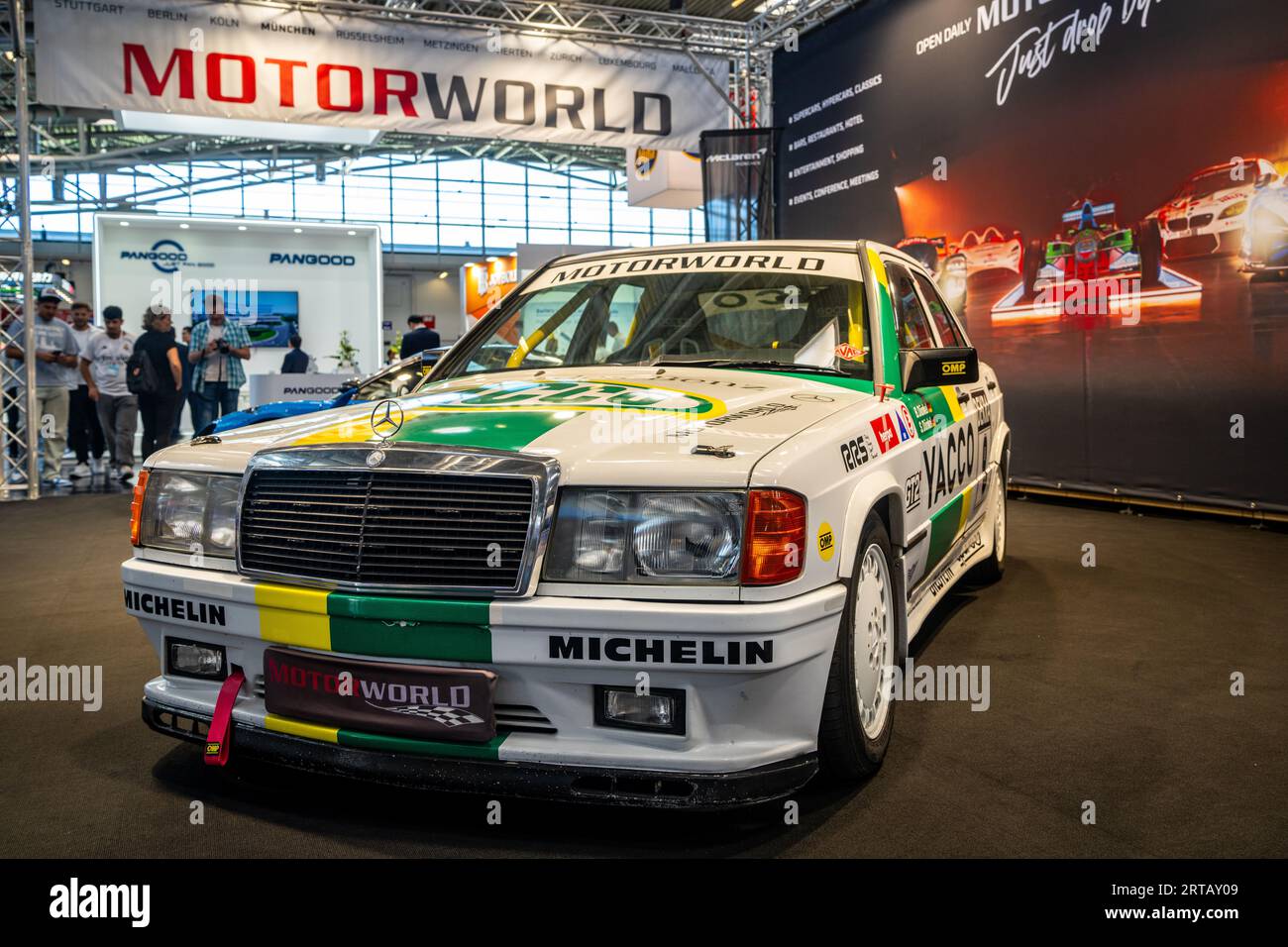 Mercedes-Benz 190E on a stand advertising the Motorworld event at IAA Mobility 2023, Munich Germany. Stock Photo