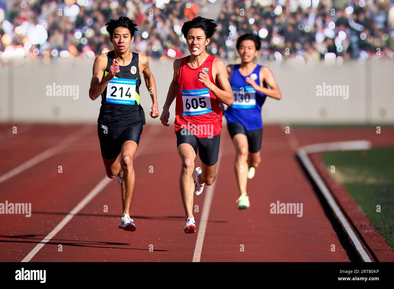 Japanese athletes running on track Stock Photo Alamy