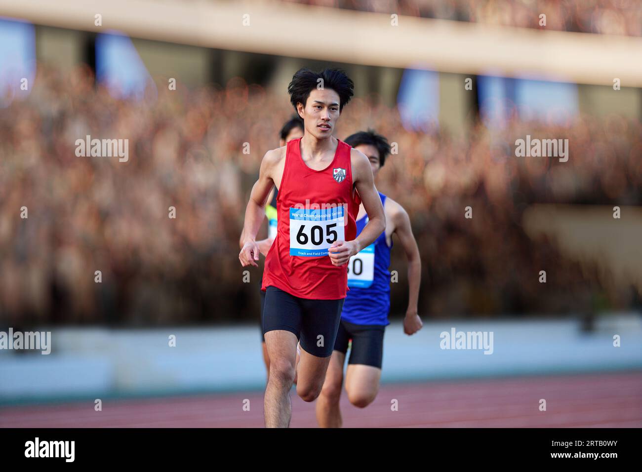 Japanese athletes running on track Stock Photo Alamy