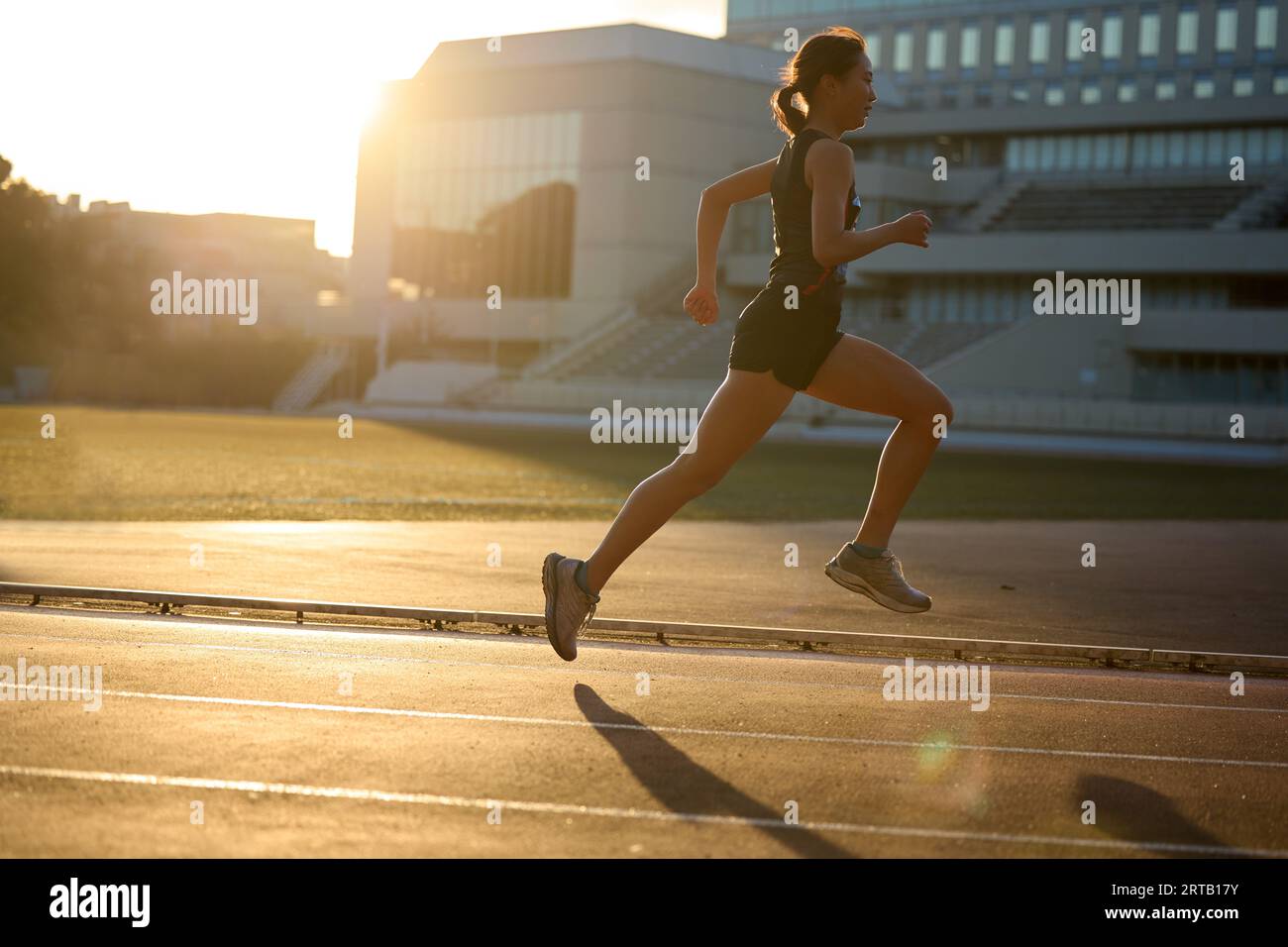 Japanese athlete running on track Stock Photo Alamy