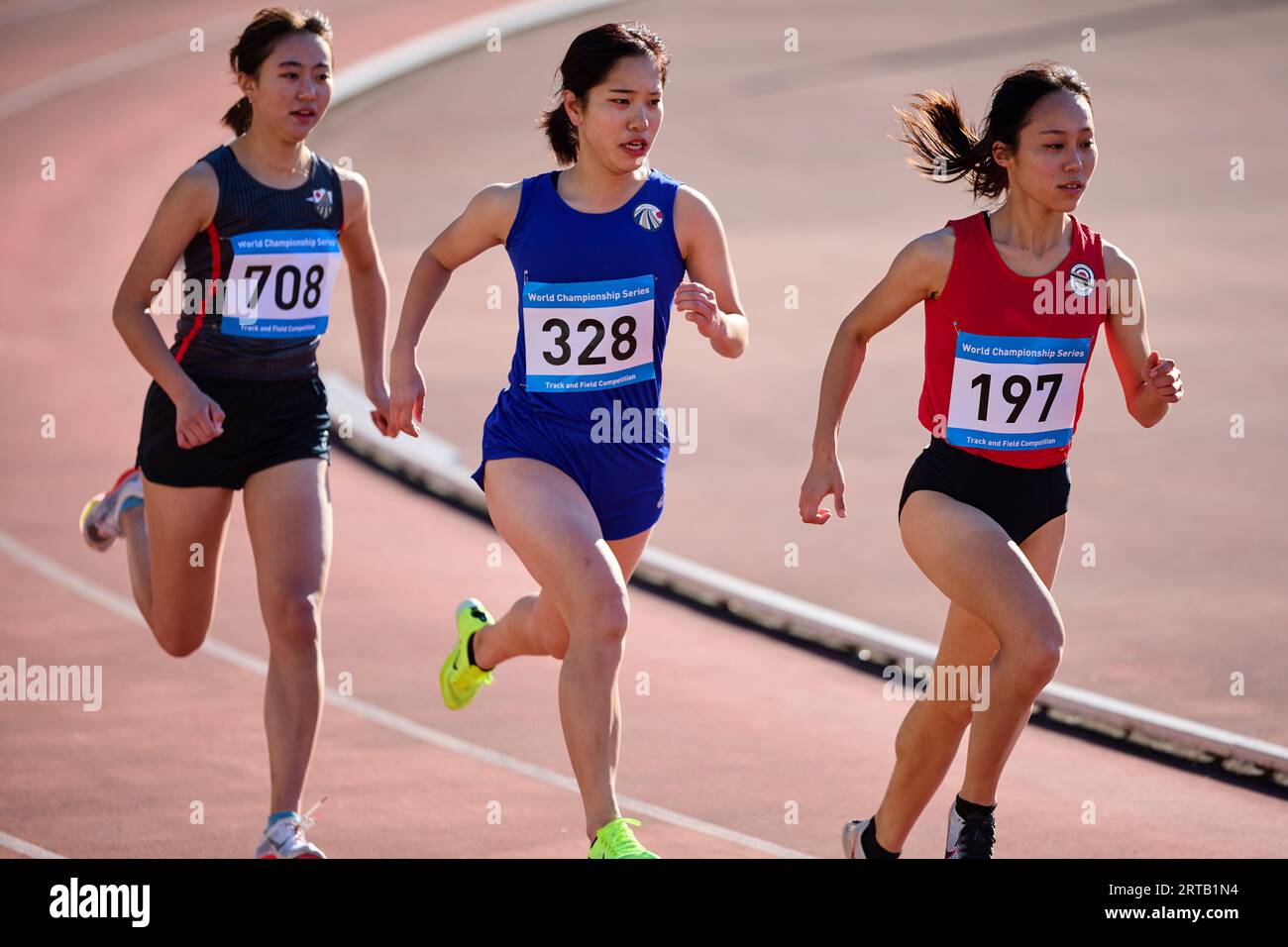 Japanese athletes running on track Stock Photo Alamy