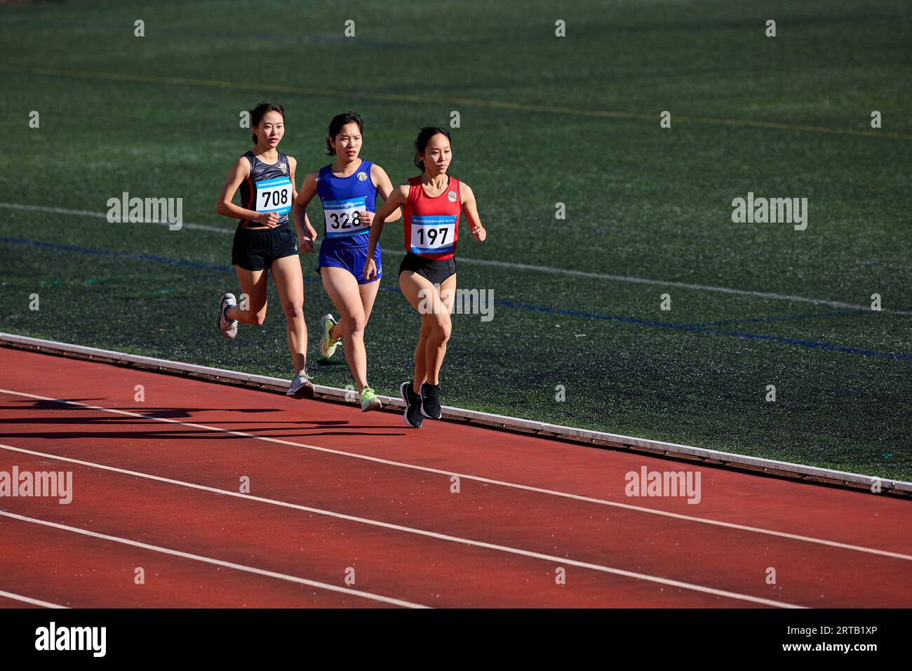 Japanese athletes running on track Stock Photo Alamy