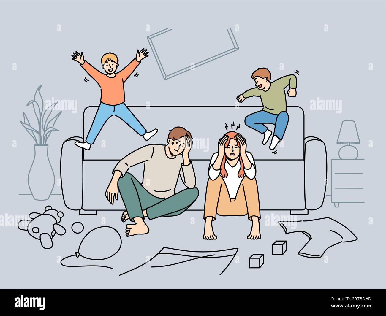 Tired parents sit on floor while mischievous children jump on sofa and