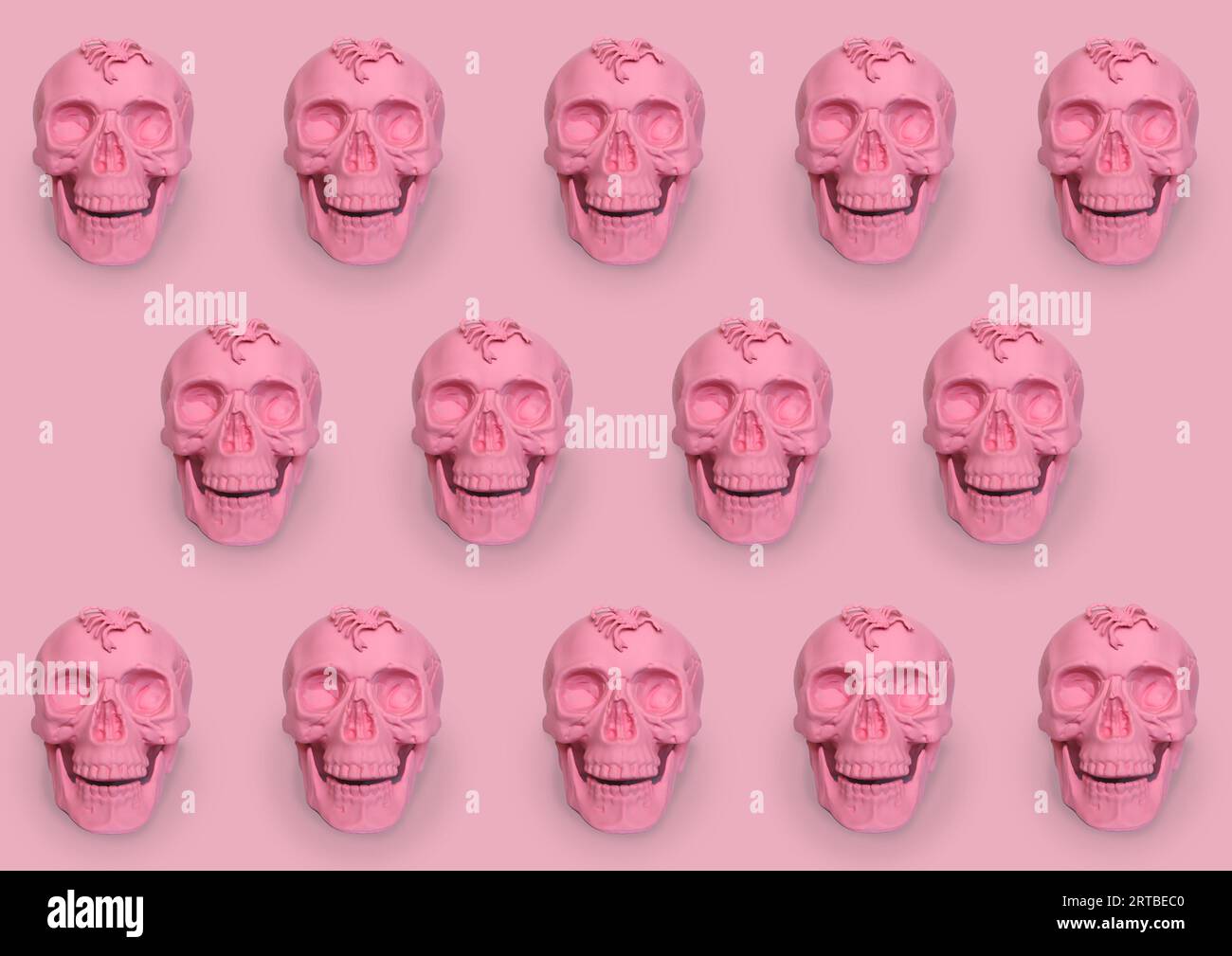 pastel pink skulls with scorpios on a pink background Stock Photo