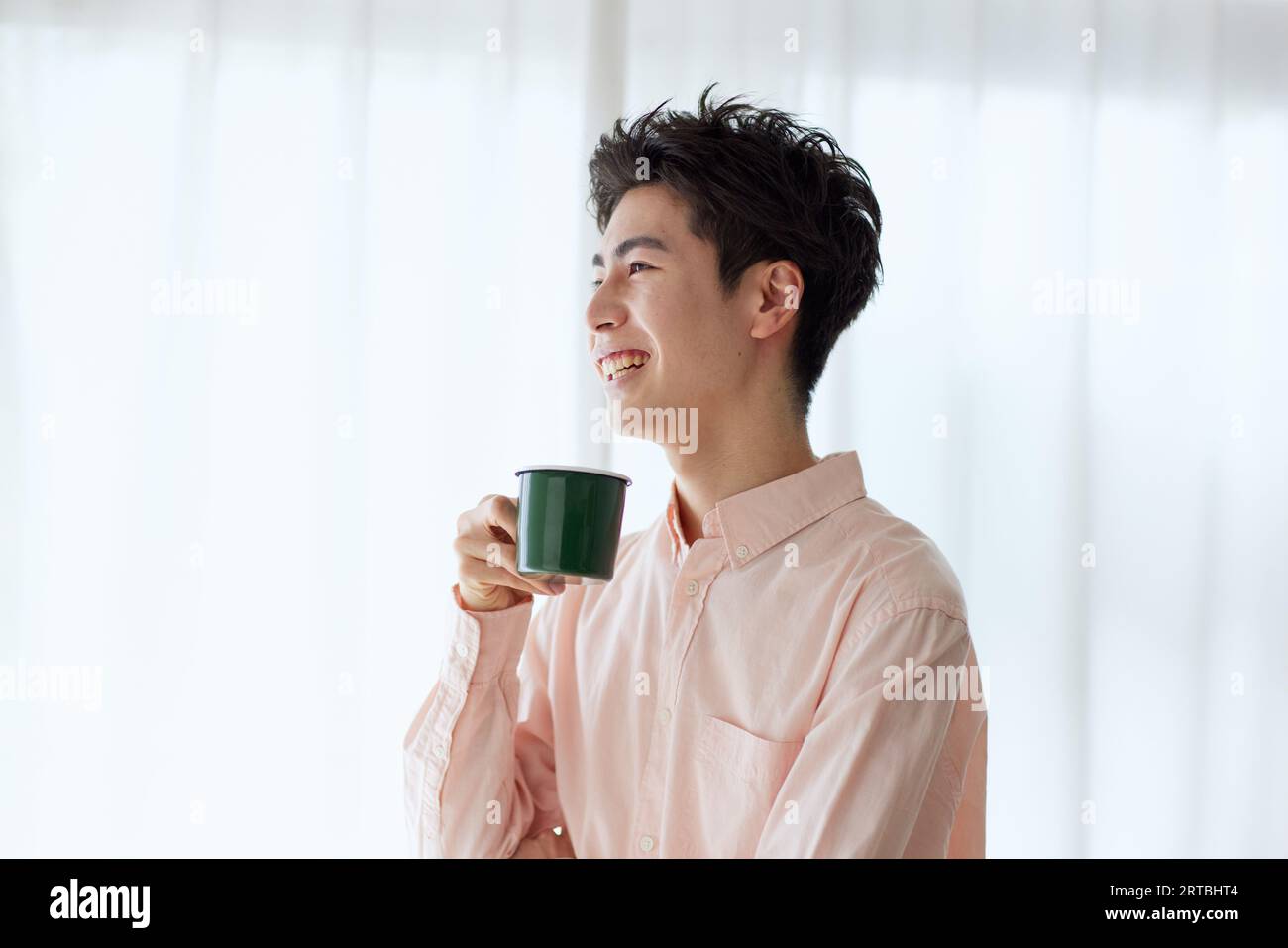 Japanese man relaxing at home Stock Photo - Alamy
