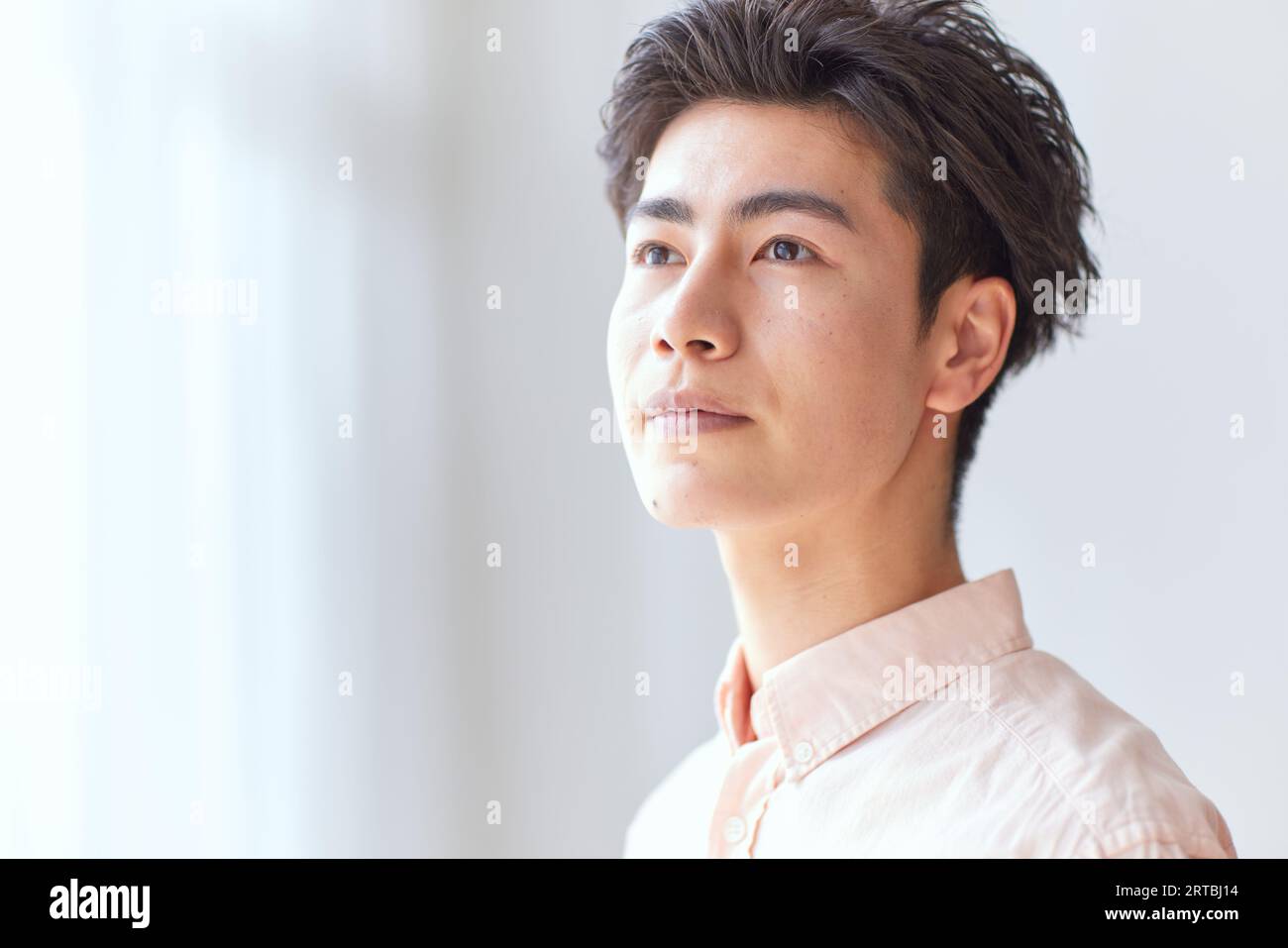 Japanese man relaxing at home Stock Photo