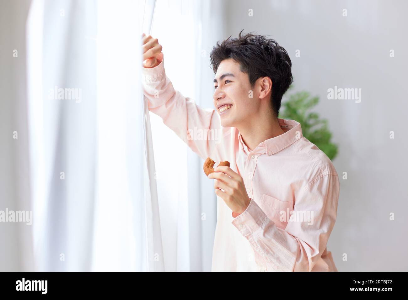 Japanese man relaxing at home Stock Photo - Alamy