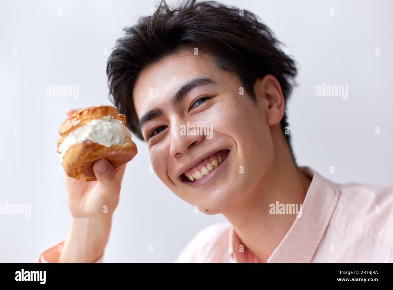 Japanese man eating at home Stock Photo