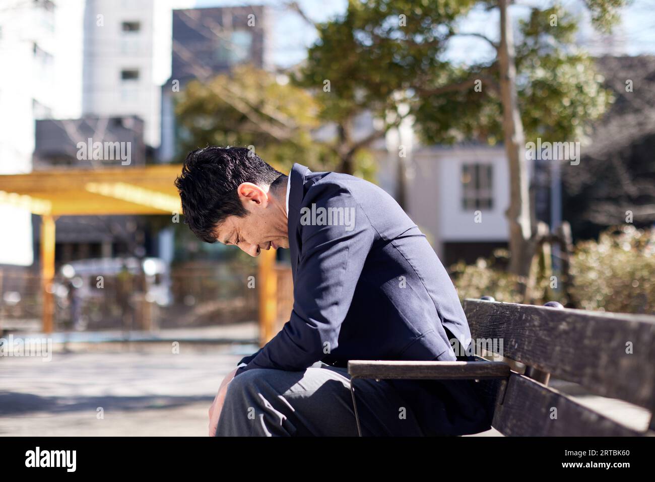 Stressed Japanese man Stock Photo