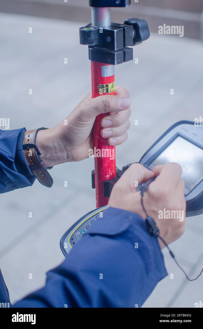 Topographer Topographer operating a differential gps Stock Photo - Alamy