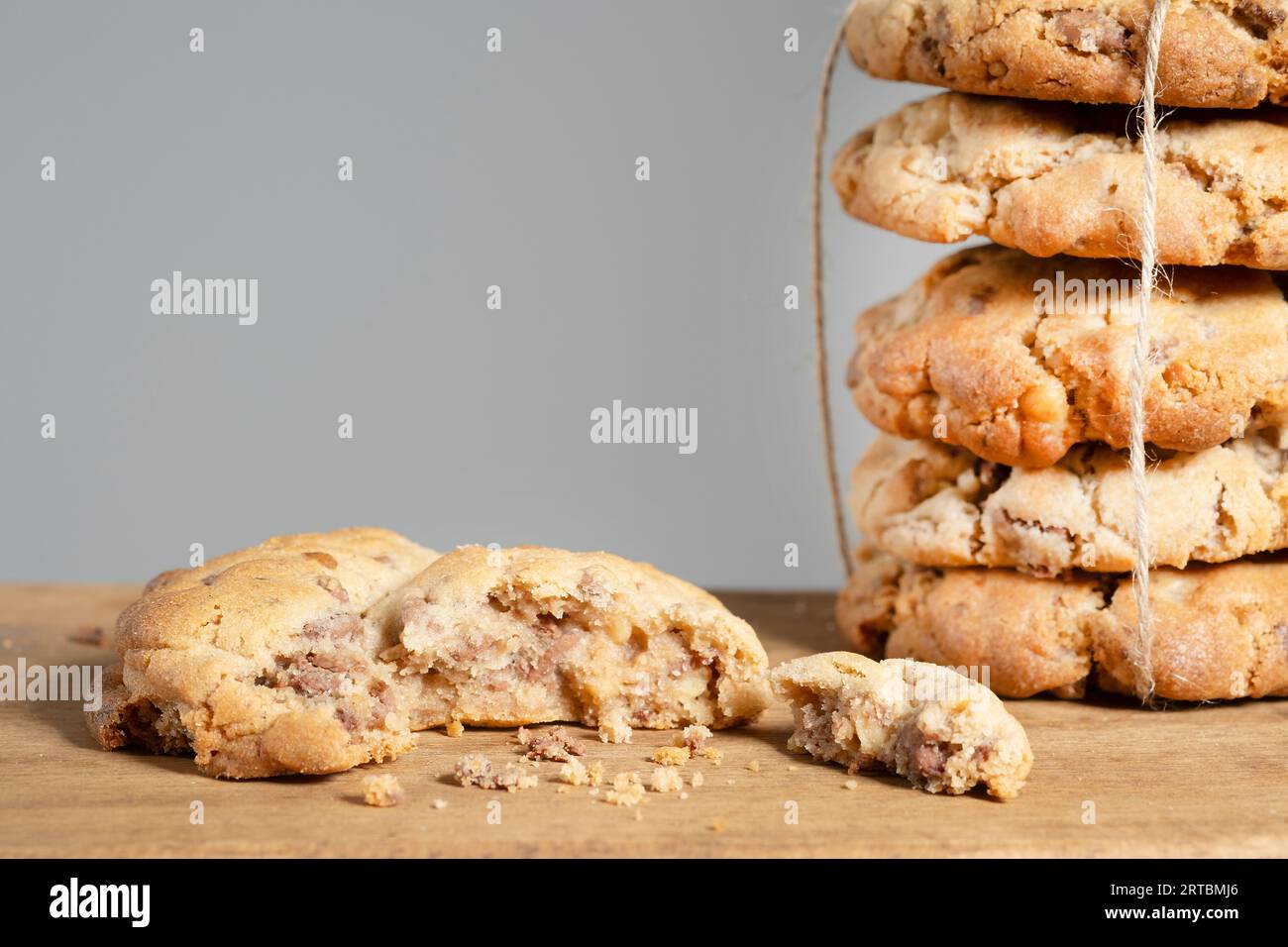 A batch of homemade New York style Chocolate Chip Cookies. They're large cookies with a  crisp outer crust and soft centre. the cookies are stacked Stock Photo