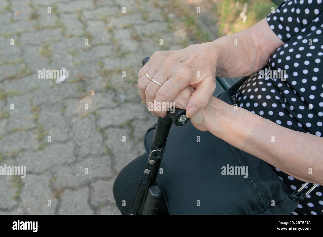 elderly person with cane, without legs and cane due to old age, walking