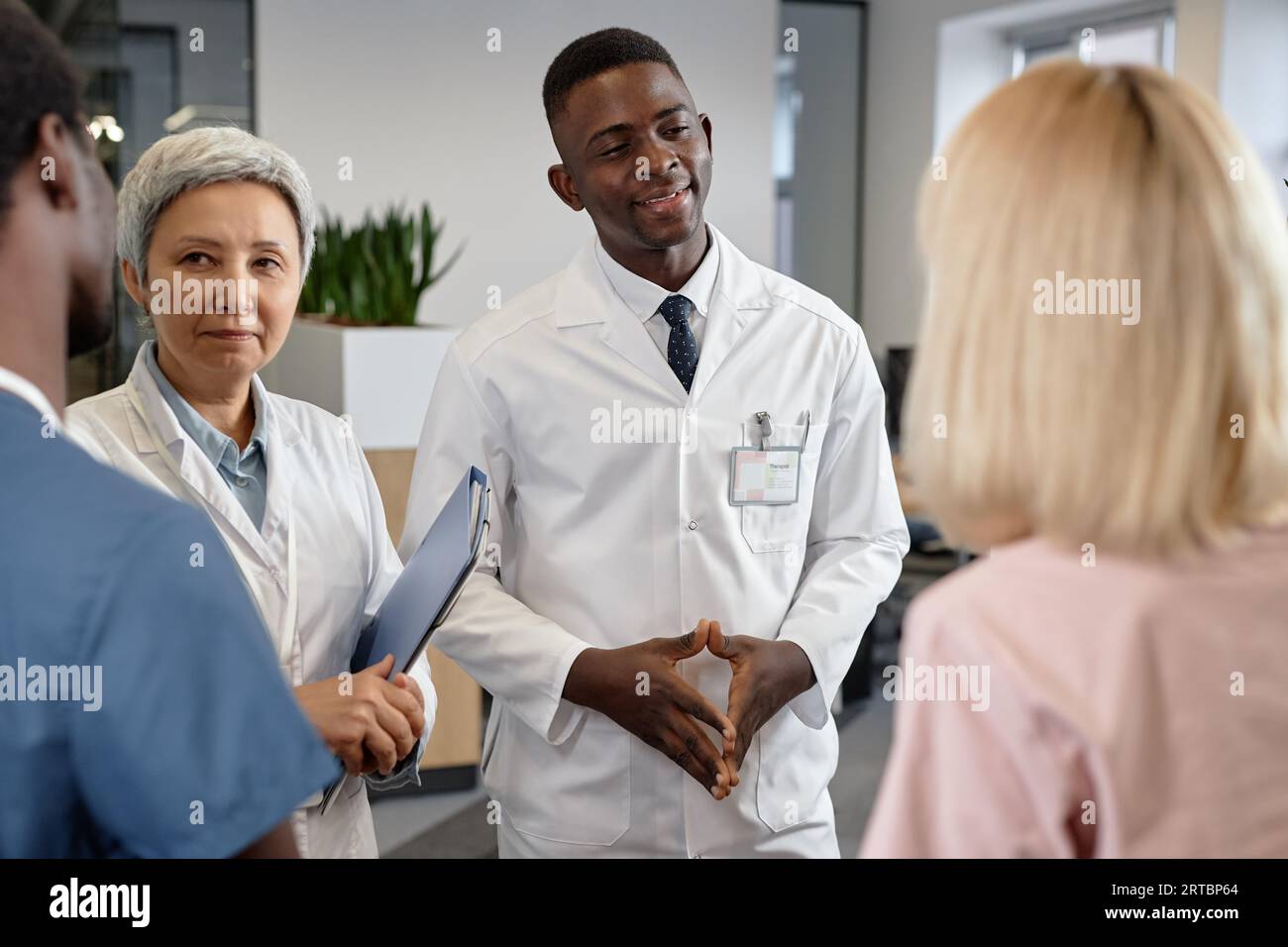Professional medical team discussing new hi-res stock photography and ...