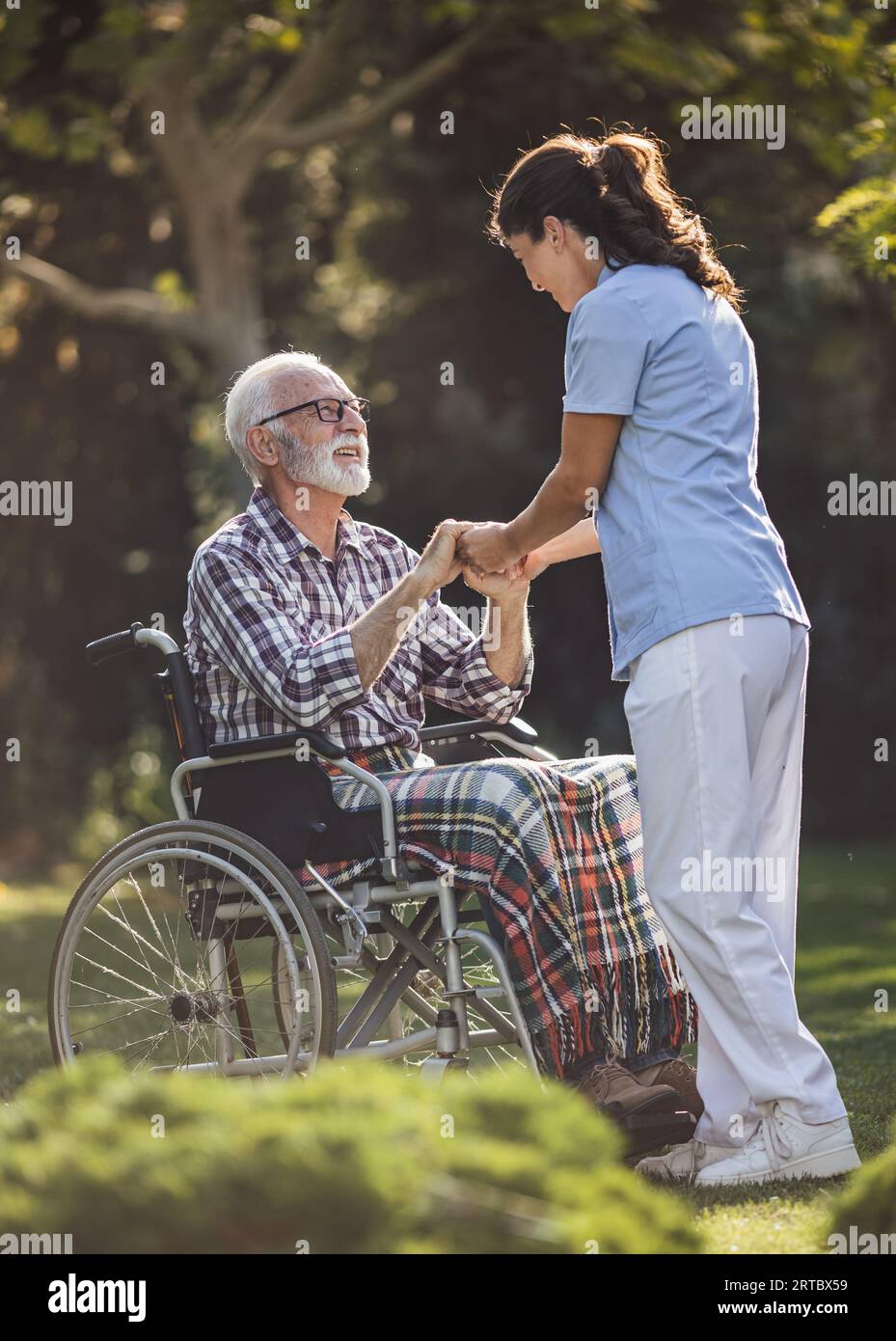Hand holding wheelchair hi-res stock photography and images - Alamy