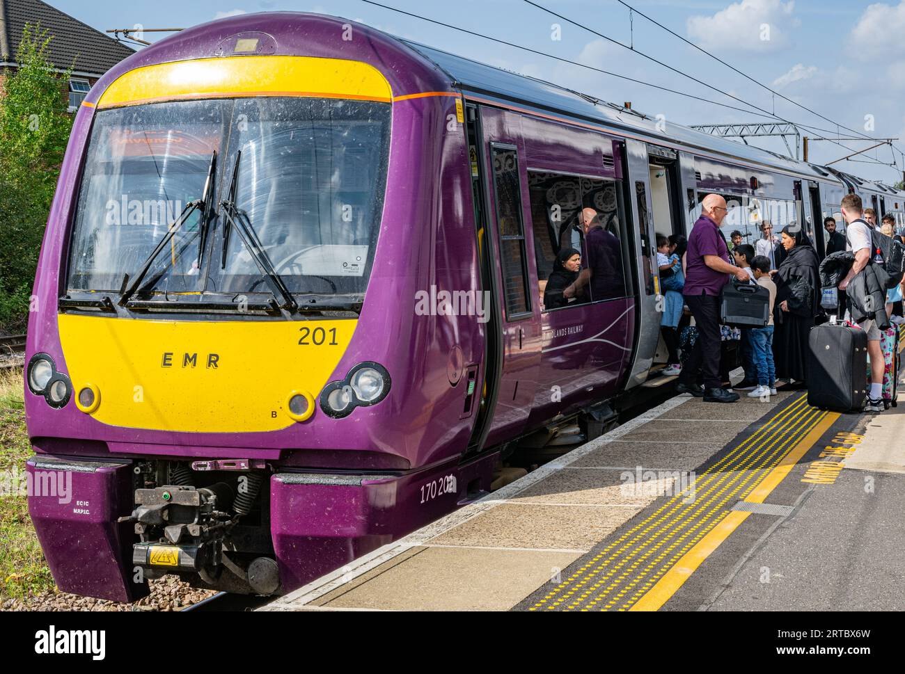 Grantham, Lincolnshire, UK – Passengers boarding a EMR (East Midlands ...