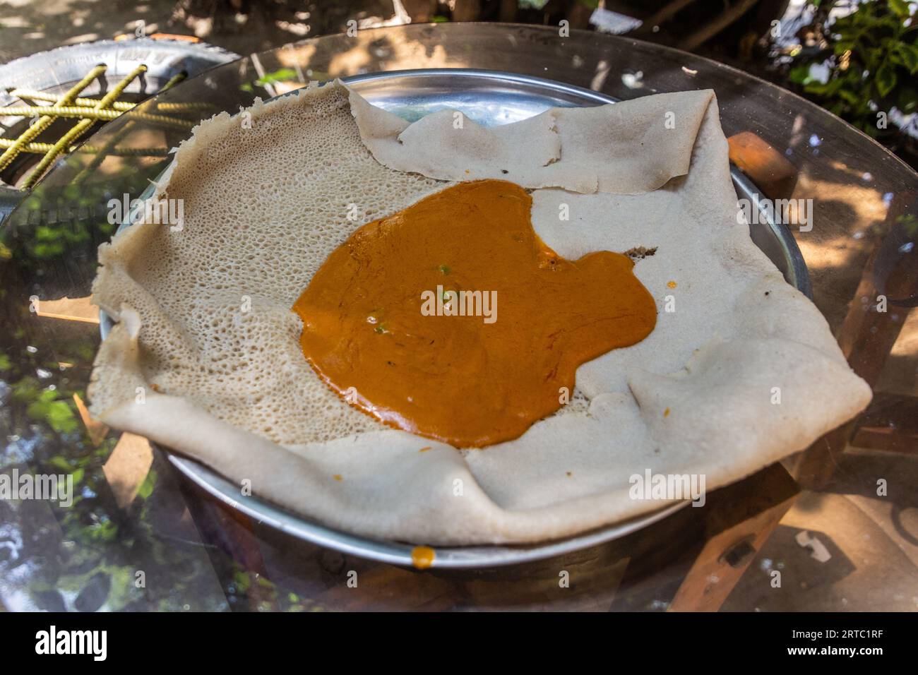 Meal in Ethiopia Shiro Wat (Chickpea stew) on injera flat bread Stock