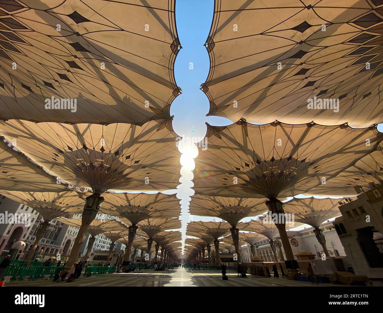 Medina, Saudi Arabia August 22, 2023 Pilgrims walk underneath giant