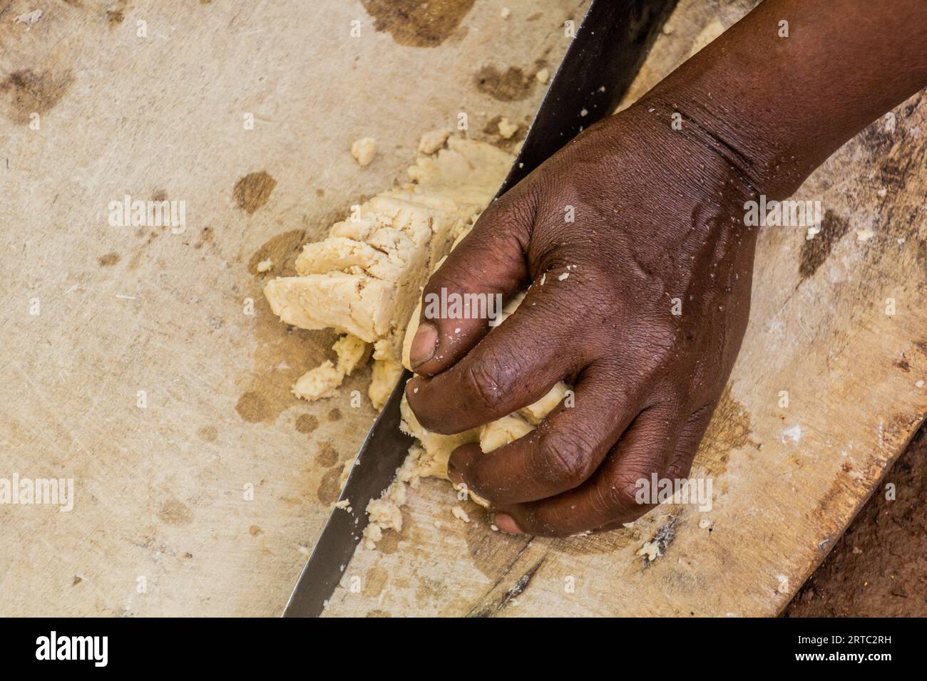 Dorze woman is preparing dough for kocho bread made of enset (false banana), important source of