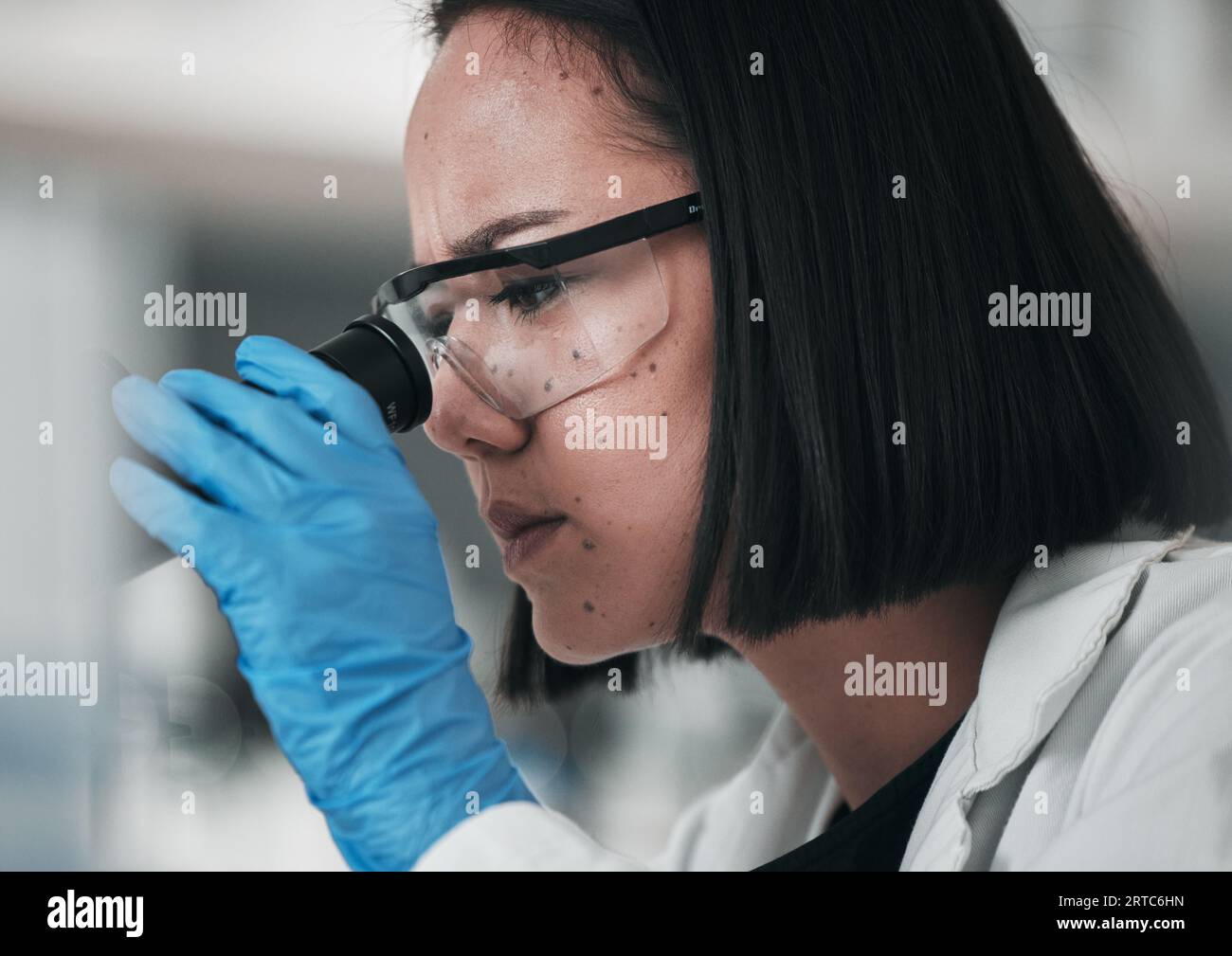 Science, healthcare and Asian woman in laboratory with microscope for ...