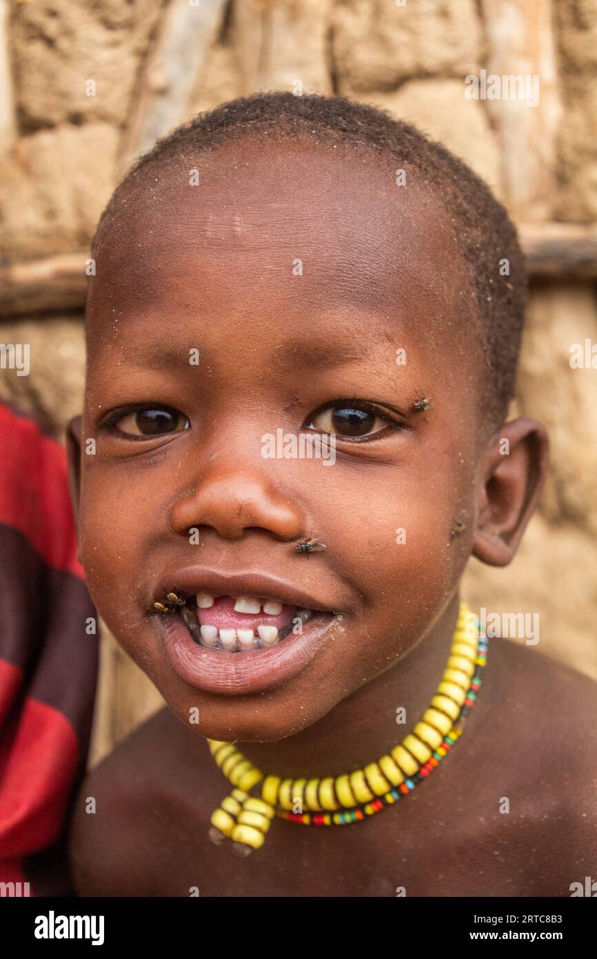 TURMI, ETHIOPIA - FEBRUARY 4, 2020: Small child in a small village of Hamer tribe near Turmi, Ethiopia Stock Photo