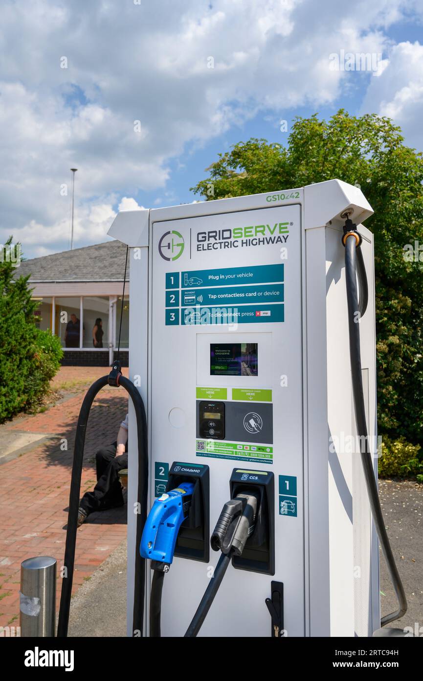Electric vehicle chanrging point at motorway services in England. Stock Photo