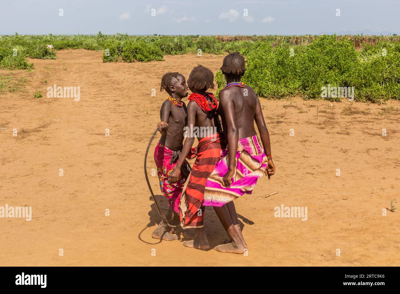 OMORATE, ETHIOPIA - FEBRUARY 5, 2020:  Daasanach tribe girls near their village near Omorate, Ethiopia Stock Photo