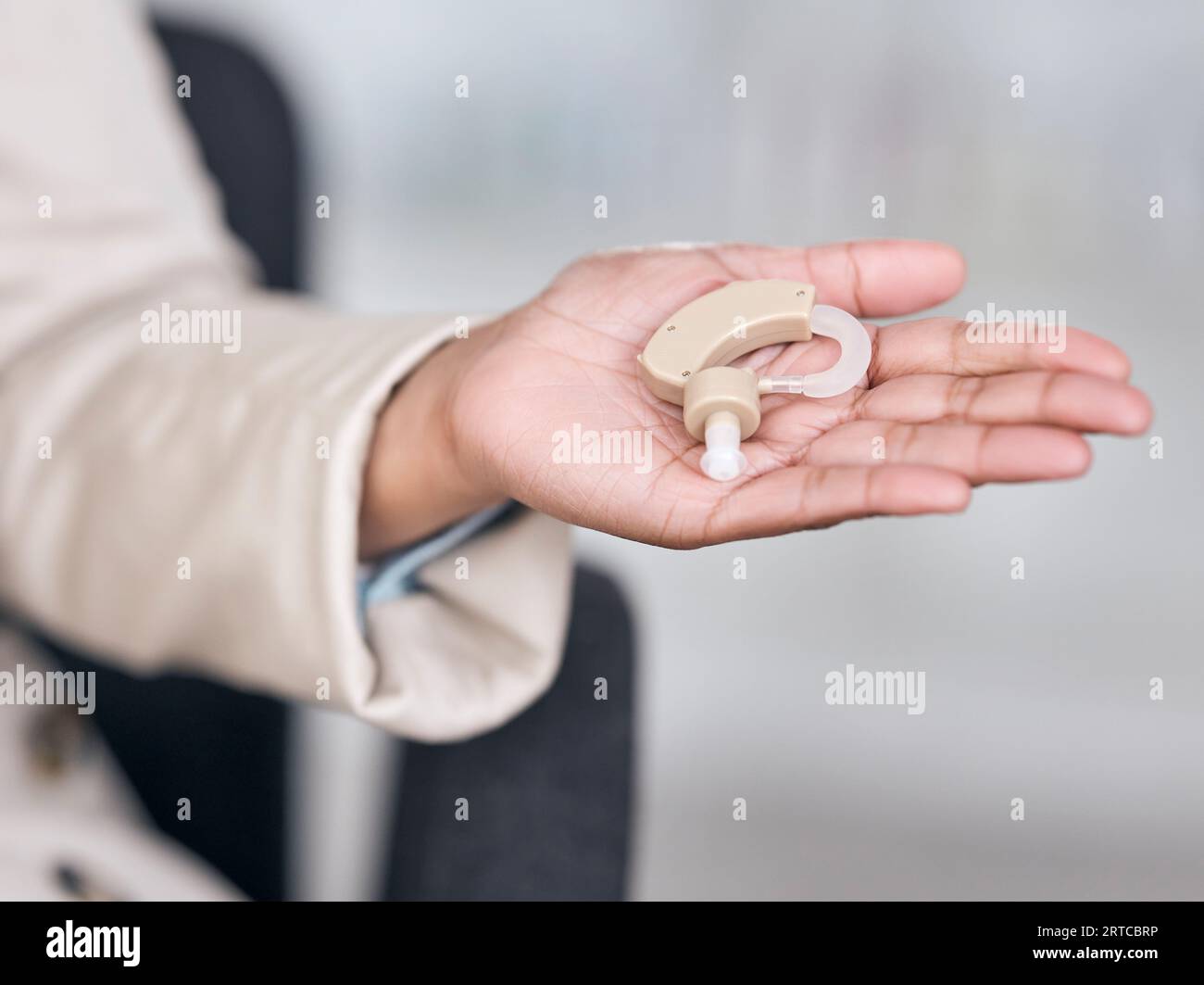 Hearing aid, medical and deaf with hands of person with a disability