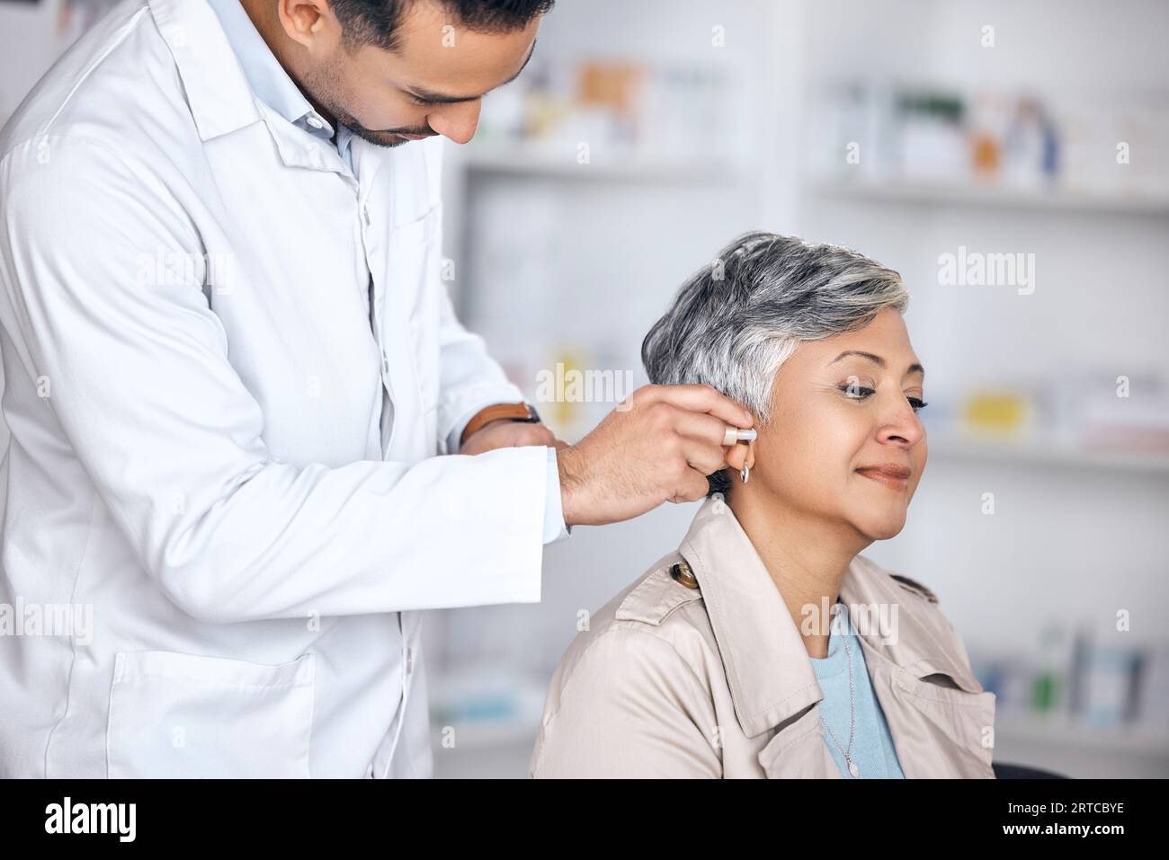 Hearing aid, medical and consulting with doctor and woman with a