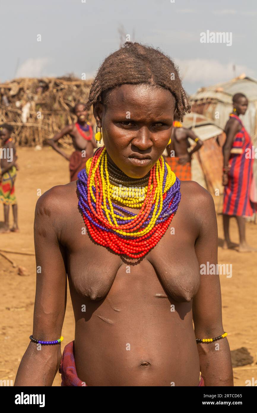 OMORATE, ETHIOPIA - FEBRUARY 5, 2020: Daasanach tribal girl in her village near Omorate, Ethiopia Stock Photo