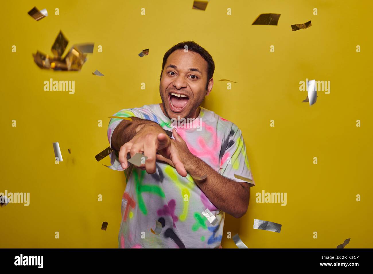 Excited indian man pointing hi-res stock photography and images - Alamy
