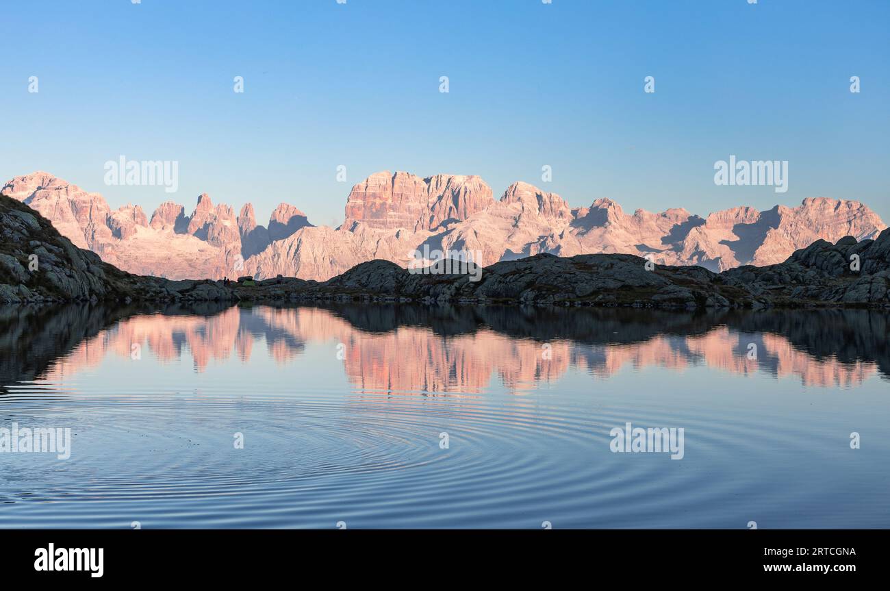 Sunset at the black lake of Cornisello with view of the Brenta Dolomites, Carisolo, Pinzolo, Trentino, Italy Stock Photo