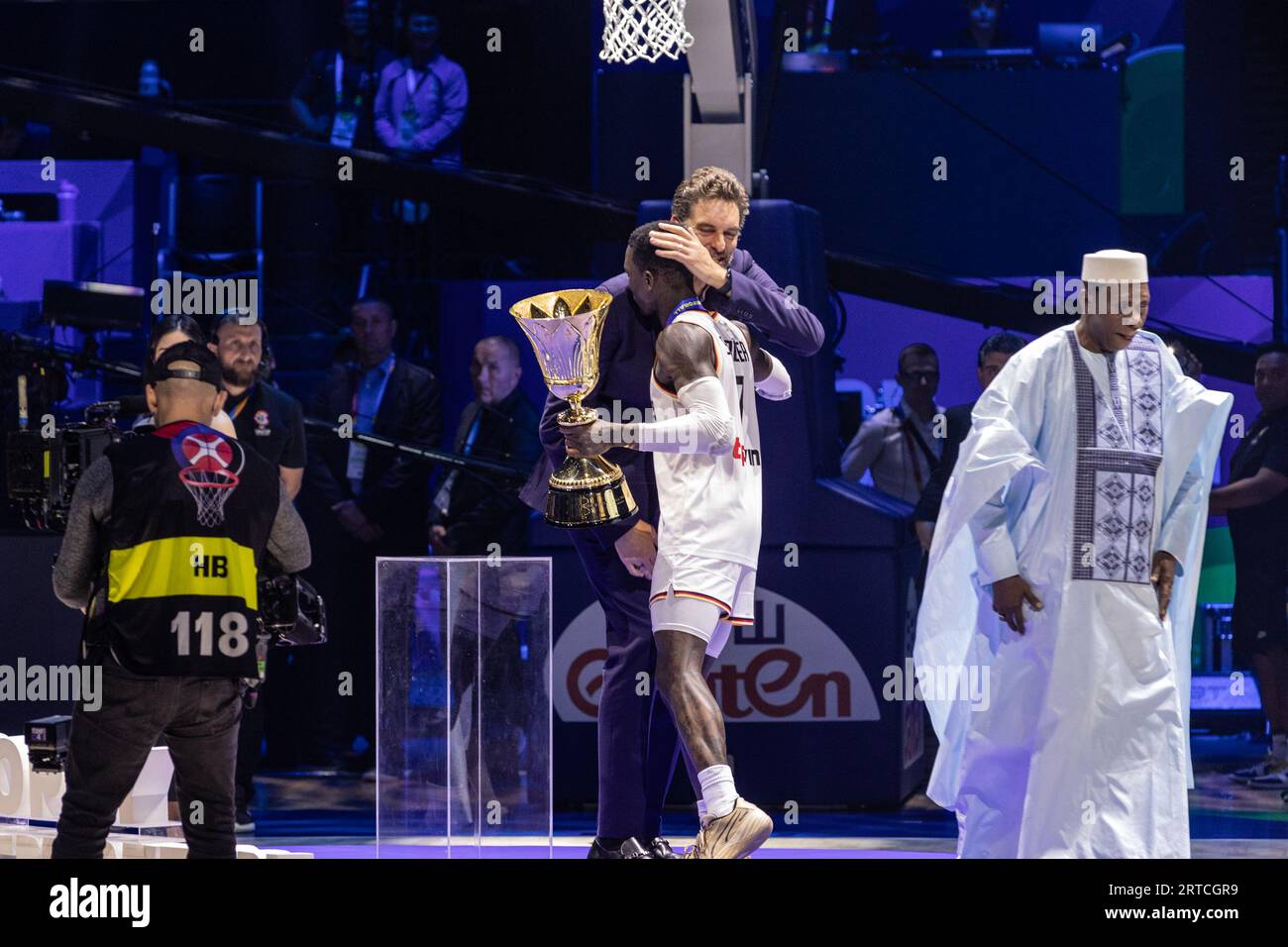 Manila, Philippines. 10th Sep, 2023. Dennis Schroder of Germany receives the championship trophy from Pau Gasol after winning the finals of the FIBA Basketball World Cup 2023 between Serbia and Germany at the Mall of Asia Arena-Manila. Final score: Germany 83:77 Serbia. Credit: SOPA Images Limited/Alamy Live News Stock Photo