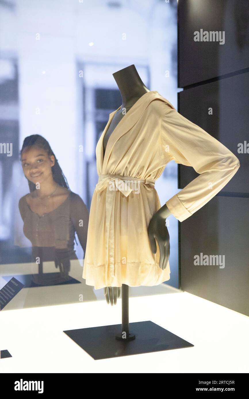EMBARGO until 1 minute past MIDNIGHT 12 SEPT London, UK. 12th Sep, 2023. A new exhibition, 'Gabrielle Chanel: Fashion Manifesto' opens at V&A, highlighting her connections to British clients, including Queen Elizabeth II. Here a woman looks at a silk jersey Mariniere blouse from 1916, one of Coco Chanel's earliest designs. Credit: Anna Watson/Alamy Live News Stock Photo
