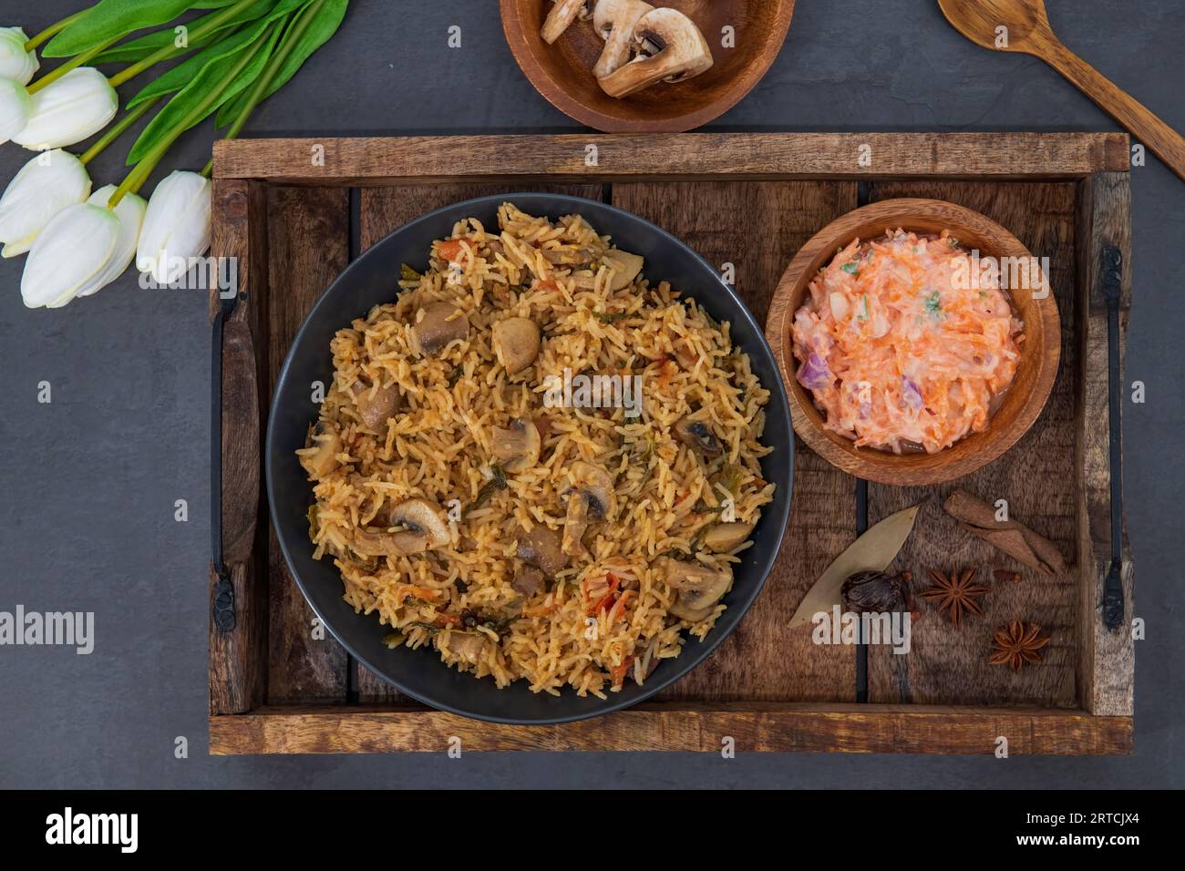 Tasty Mushroom or Mashroom Rice or Pulav or Pilaf or Pulao or Biryani served in bowl or plate. Delicious Mushroom fried rice with isolated background. Stock Photo