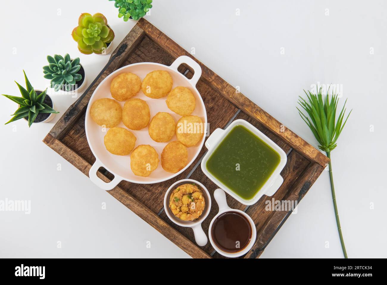 Desi Indian Street Food called Golgappe or Pani Puri.Famous Indian starter. Pani puri chaat, an Indian street food popular in Kolkata, Mumbai, Delhi Stock Photo
