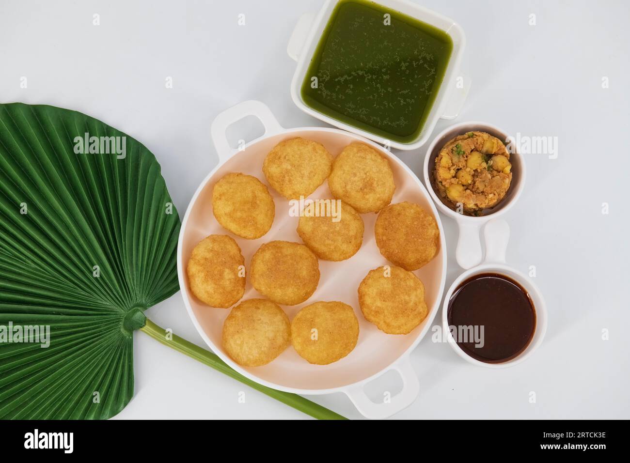 Desi Indian Street Food called Golgappe or Pani Puri.Famous Indian starter. Pani puri chaat, an Indian street food popular in Kolkata, Mumbai, Delhi Stock Photo