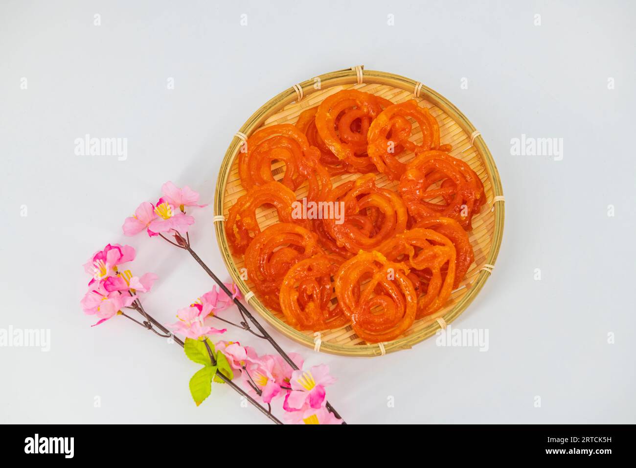 Jalebi or Jilebi Jangri - traditional Indian festival sweet isolated with white background. Popular Indian sweet Jalebi and Fafda served with Sambhara Stock Photo