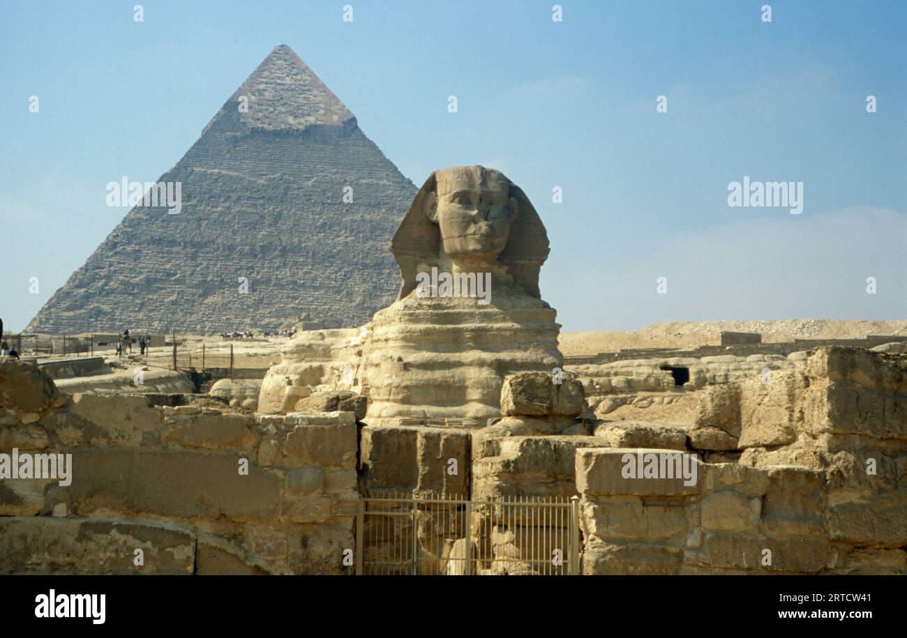 The Great Sphinx of Giza framed by the Great Pyramid of Khufu in the ...