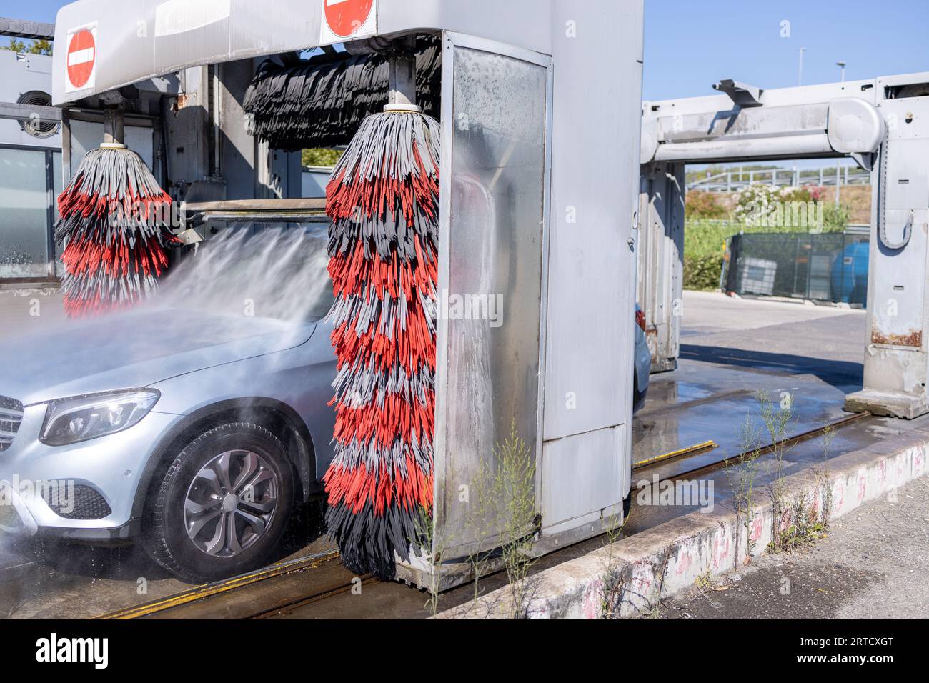 Car washing process in Automatic Car washer. Water spraying, rinsing
