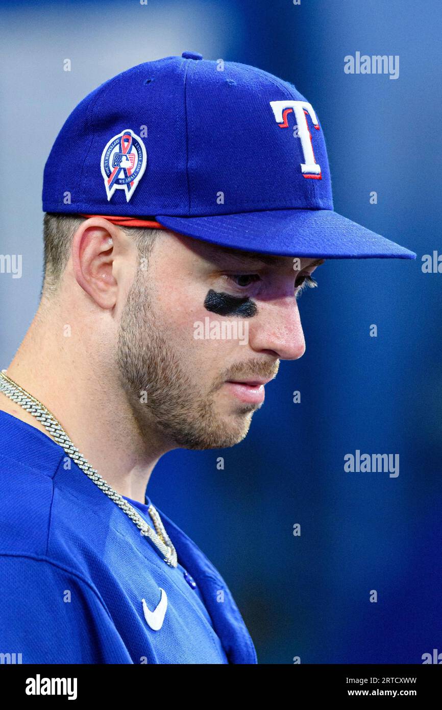 TORONTO, ON - SEPTEMBER 11: Texas Rangers Designated hitter Mitch Garver  (18) wears a hat with a MLB 9/11 logo on it to commemorate 9/11 during the MLB  baseball regular season game