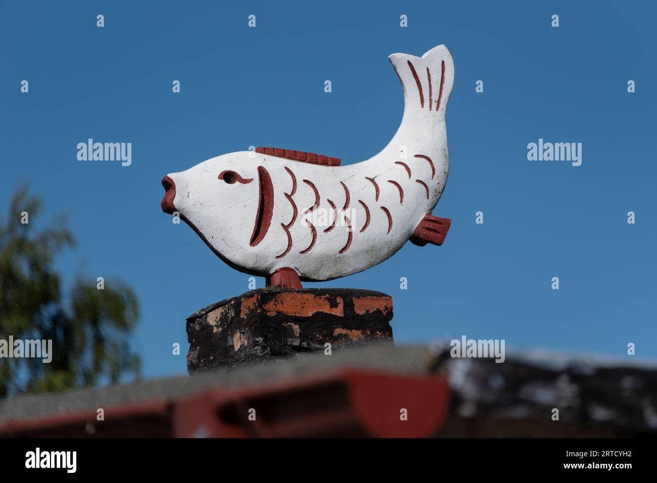 Wooden fish, stands on a fish smokehouse, Vitte, Hiddensee Island, Mecklenburg-West Pomerania, Germany Stock Photo