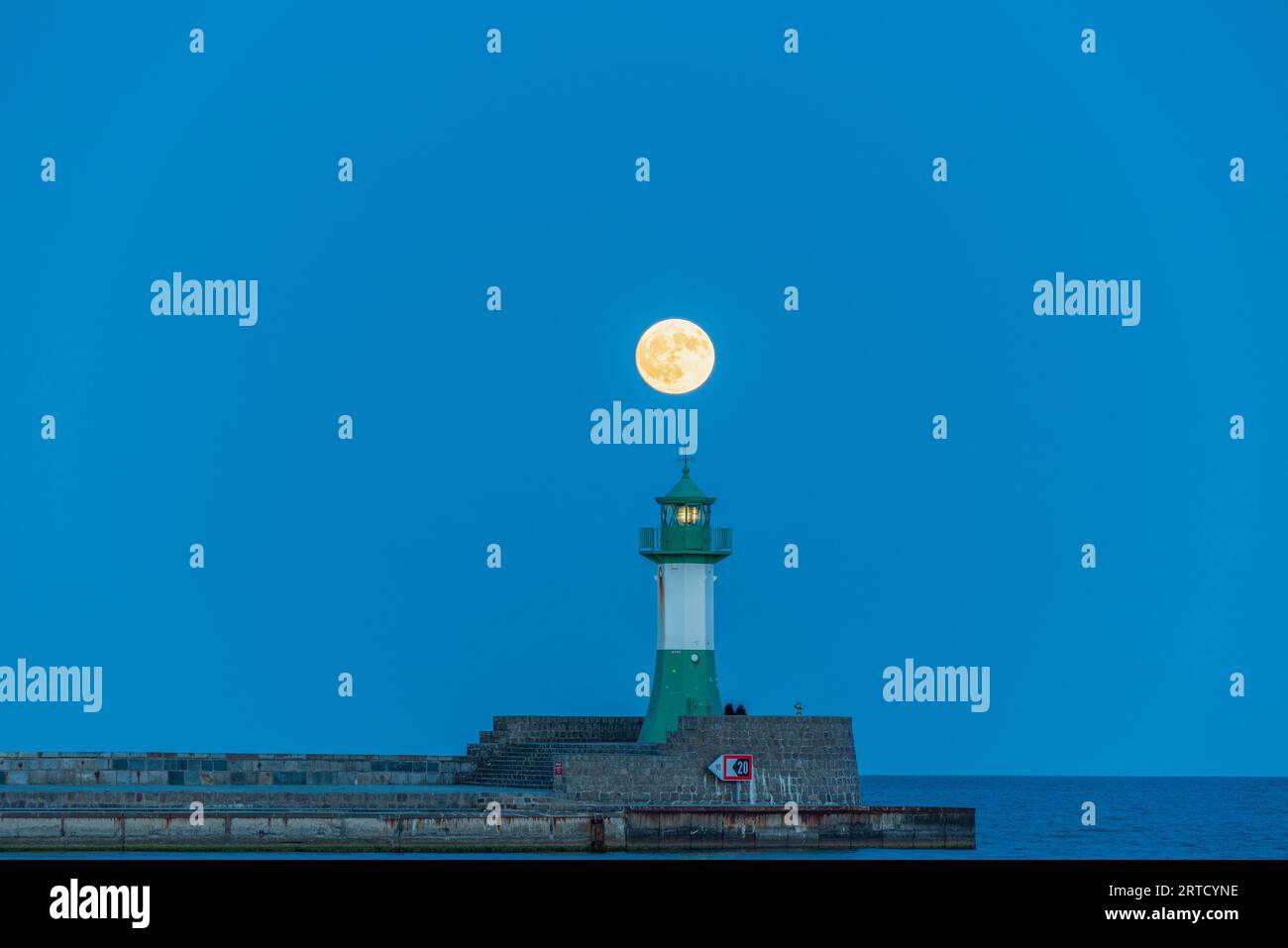Sassnitz lighthouse, full moon behind, Rügen Island, Sassnitz, Mecklenburg-West Pomerania, Germany Stock Photo
